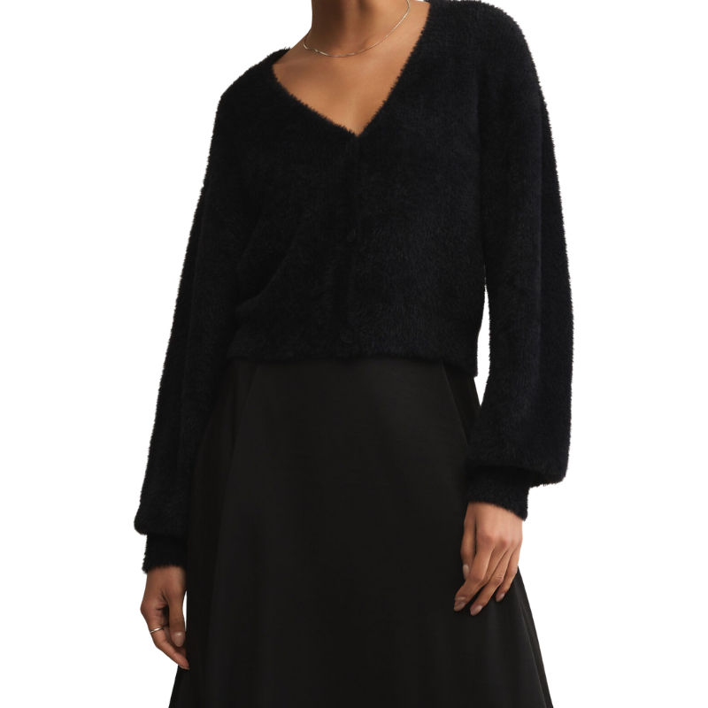 Black sweater and skirt set on a white background