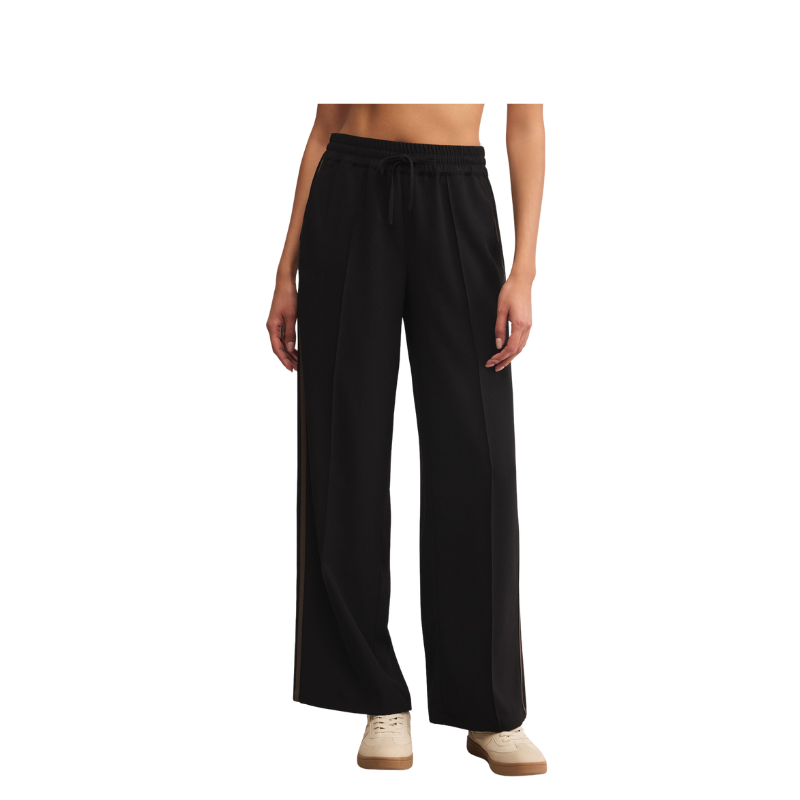 Black wide-leg pants worn by a person on a white background