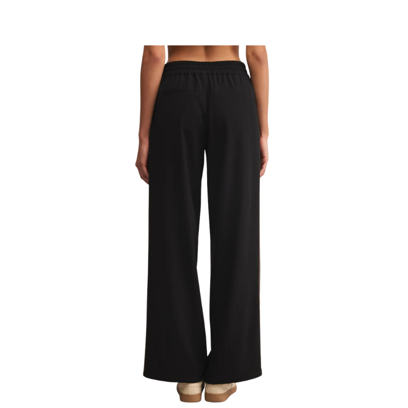 Black wide-leg pants worn by a person on a white background