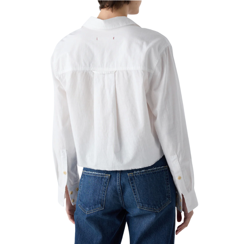 Person wearing a white shirt and blue jeans on a white background