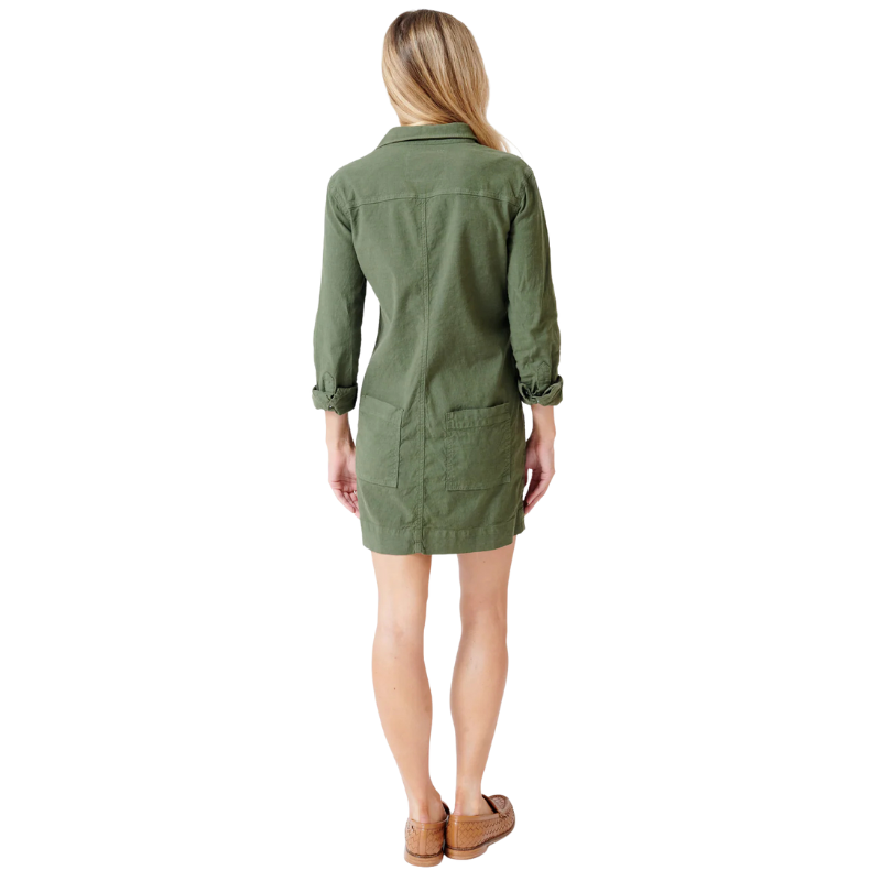 Woman wearing a green dress on a white background