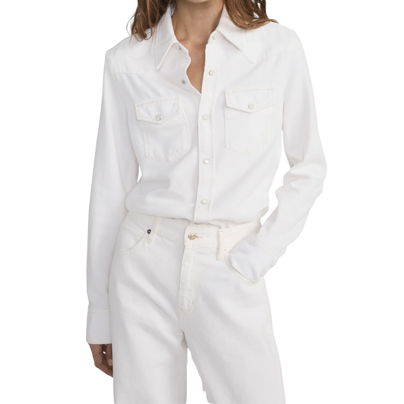 White denim shirt and pants worn by a person on a white background