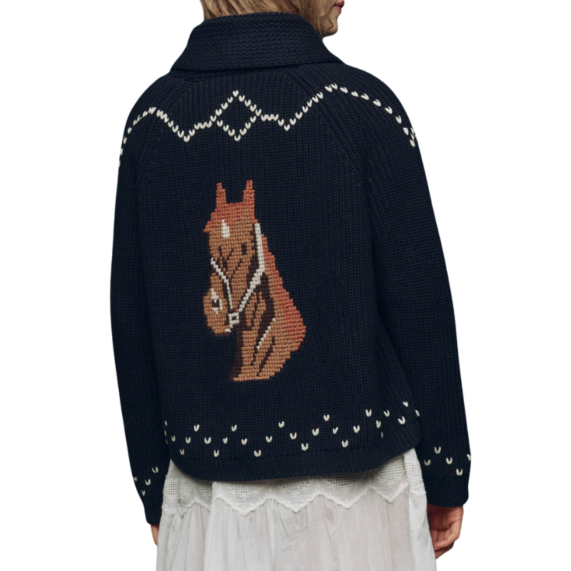 Navy blue sweater with horse design on the back, worn by a person.