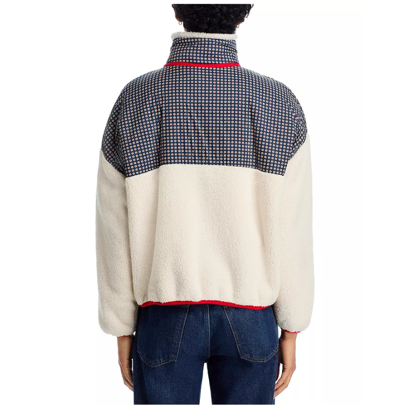 Person wearing a two-tone fleece pullover with checkered pattern on a white background