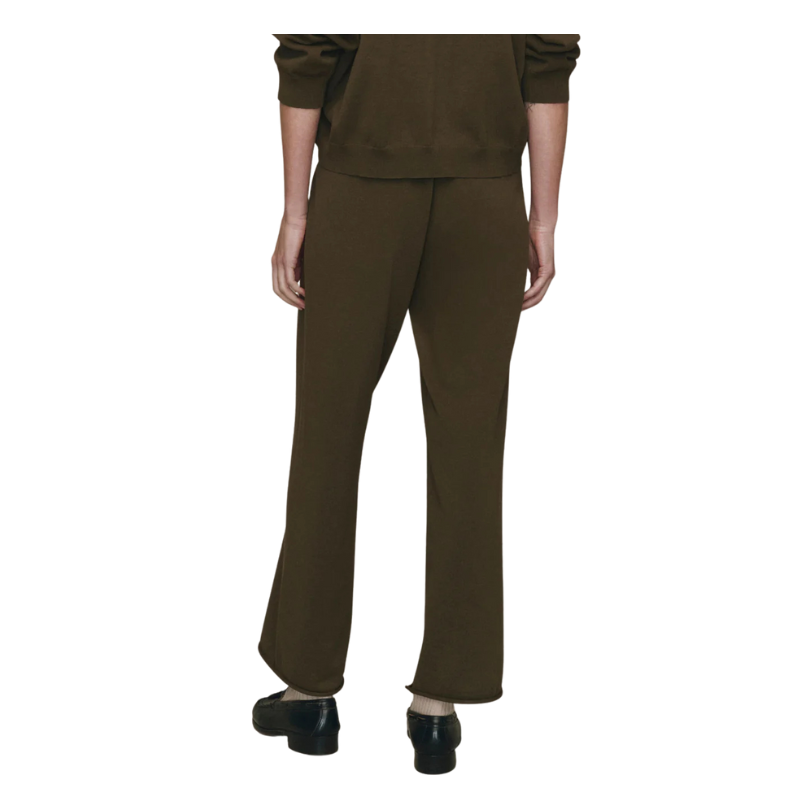 Person wearing a brown outfit on a white background