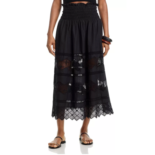 Black lace skirt worn by a person on a white background