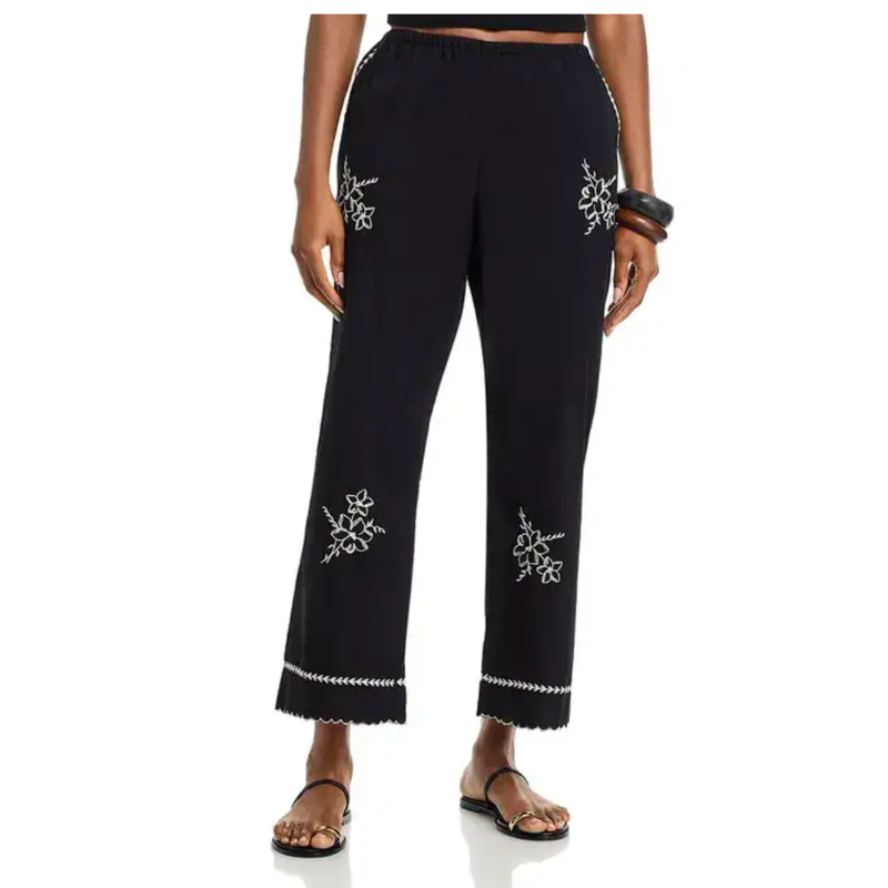 Black pants with white embroidery on a white background