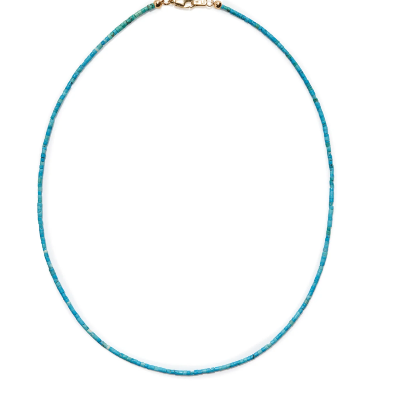 Turquoise beaded necklace on a white background