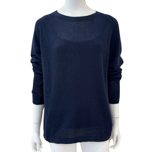Navy blue sweater on a mannequin against a white background