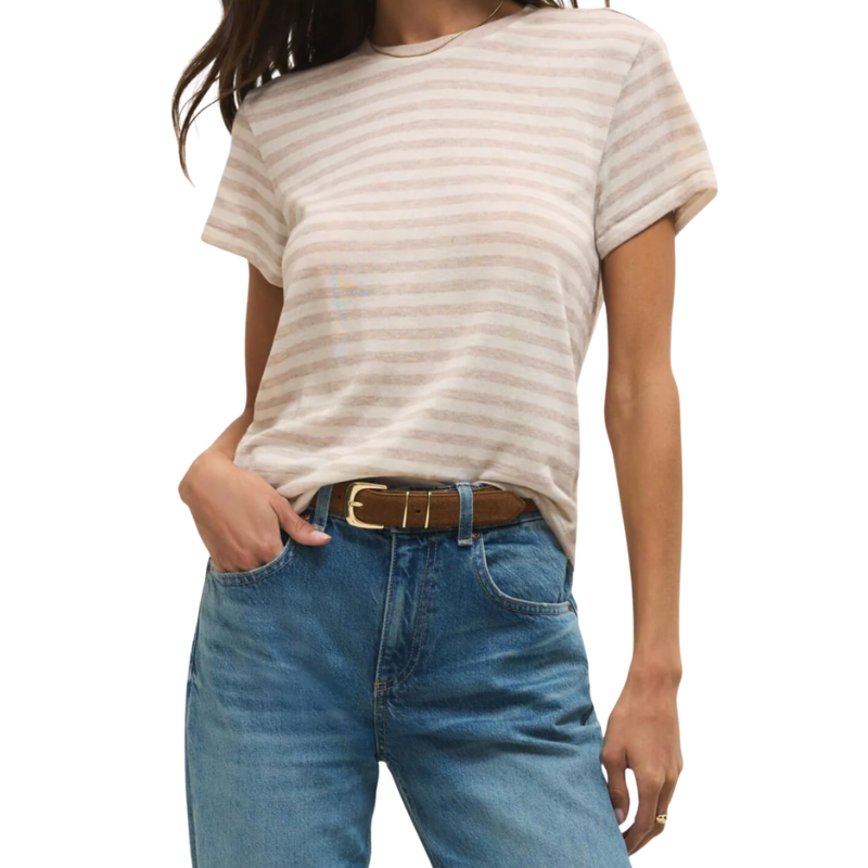Person wearing a striped t-shirt and blue jeans on a white background