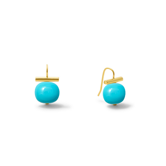 Turquoise earrings with gold hooks on a white background