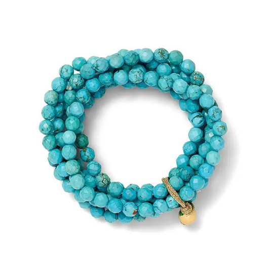 Turquoise beaded bracelet with a gold clasp on a white background