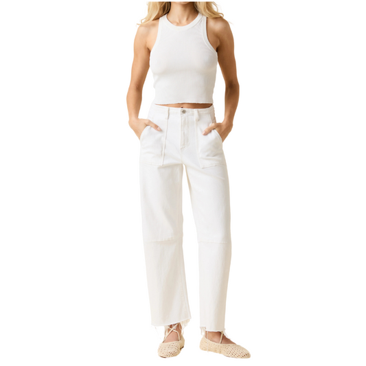 Person wearing a white sleeveless top and pants on a white background