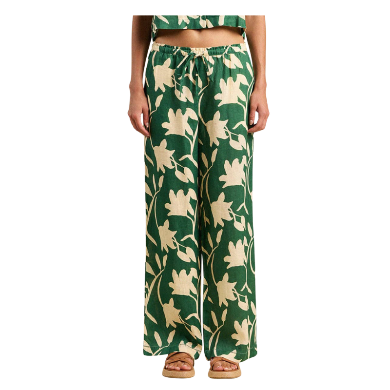 Green floral patterned pants on a white background