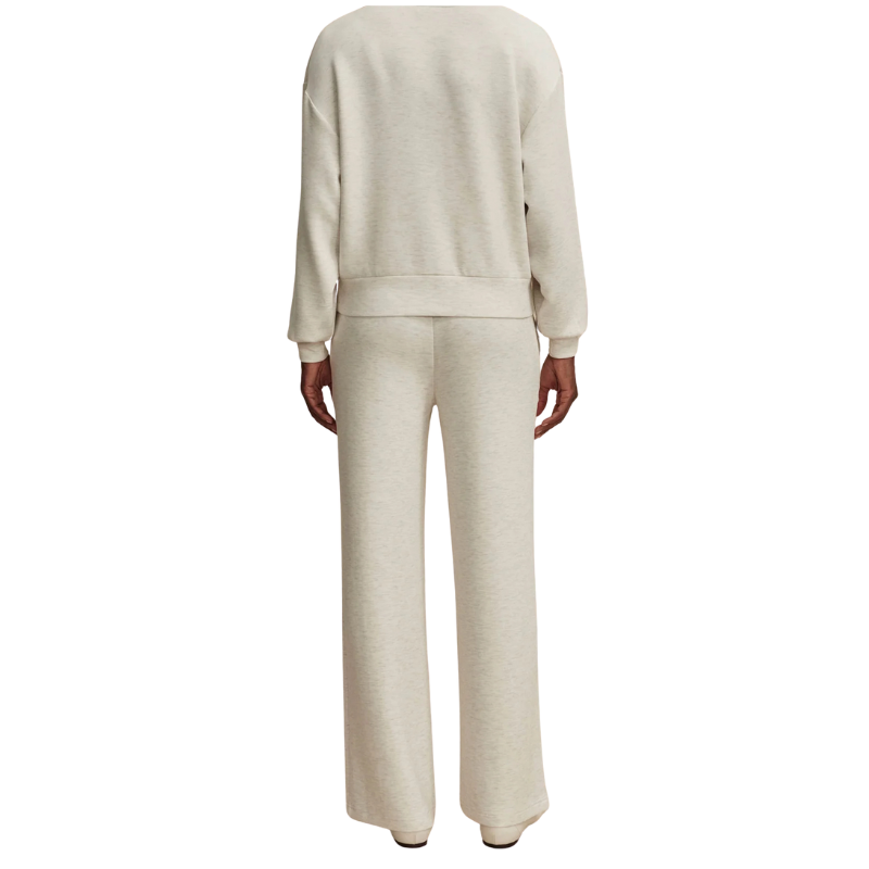 Beige tracksuit worn by a person on a white background
