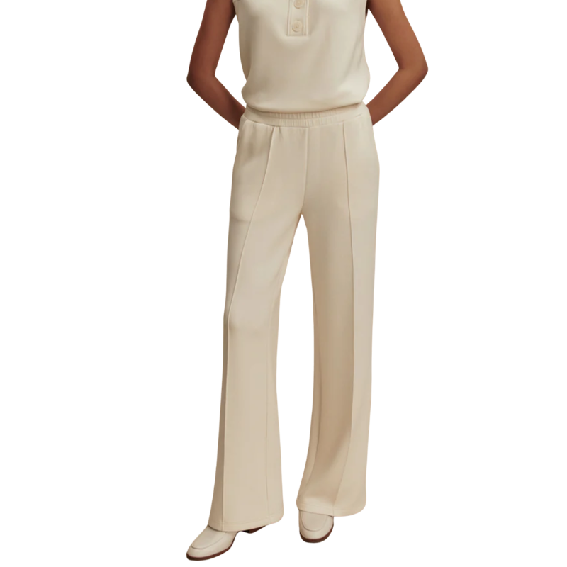 Beige pants worn by a person on a white background