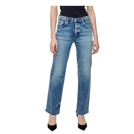 Blue jeans worn by a person on a white background