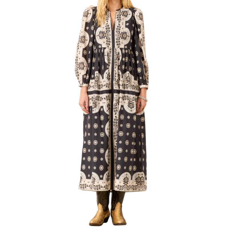 Long patterned dress worn by a person on a white background