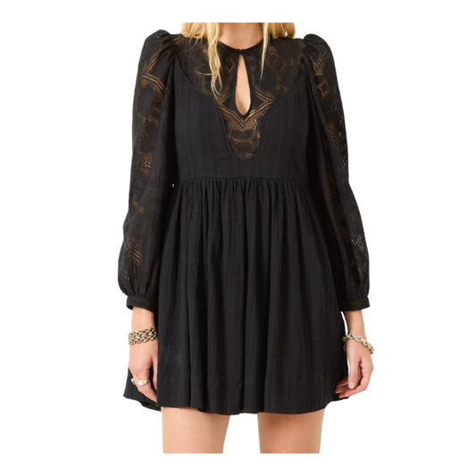 Black dress with intricate lace details on a white background