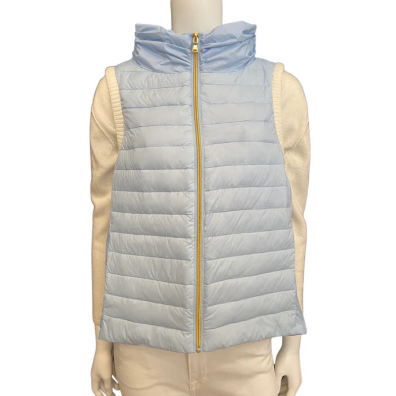 Light blue puffer vest on a mannequin with a white background