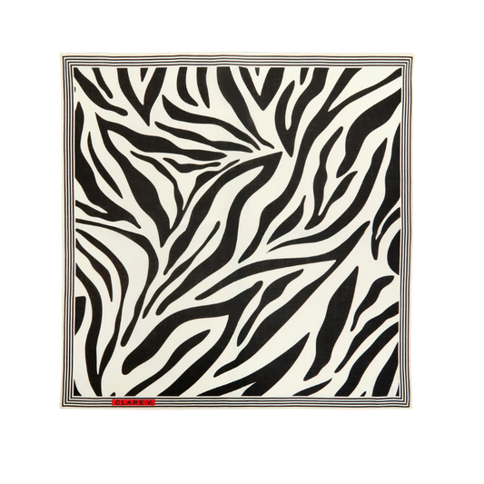 Zebra patterned rug with a brand label on a white background