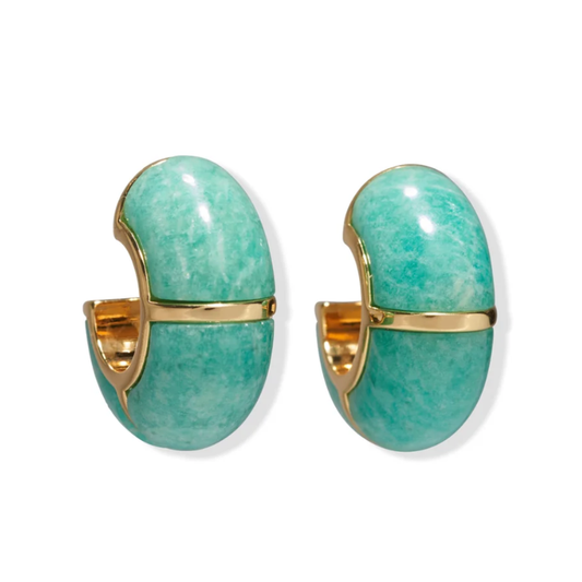 Turquoise hoop earrings with gold accents on a white background
